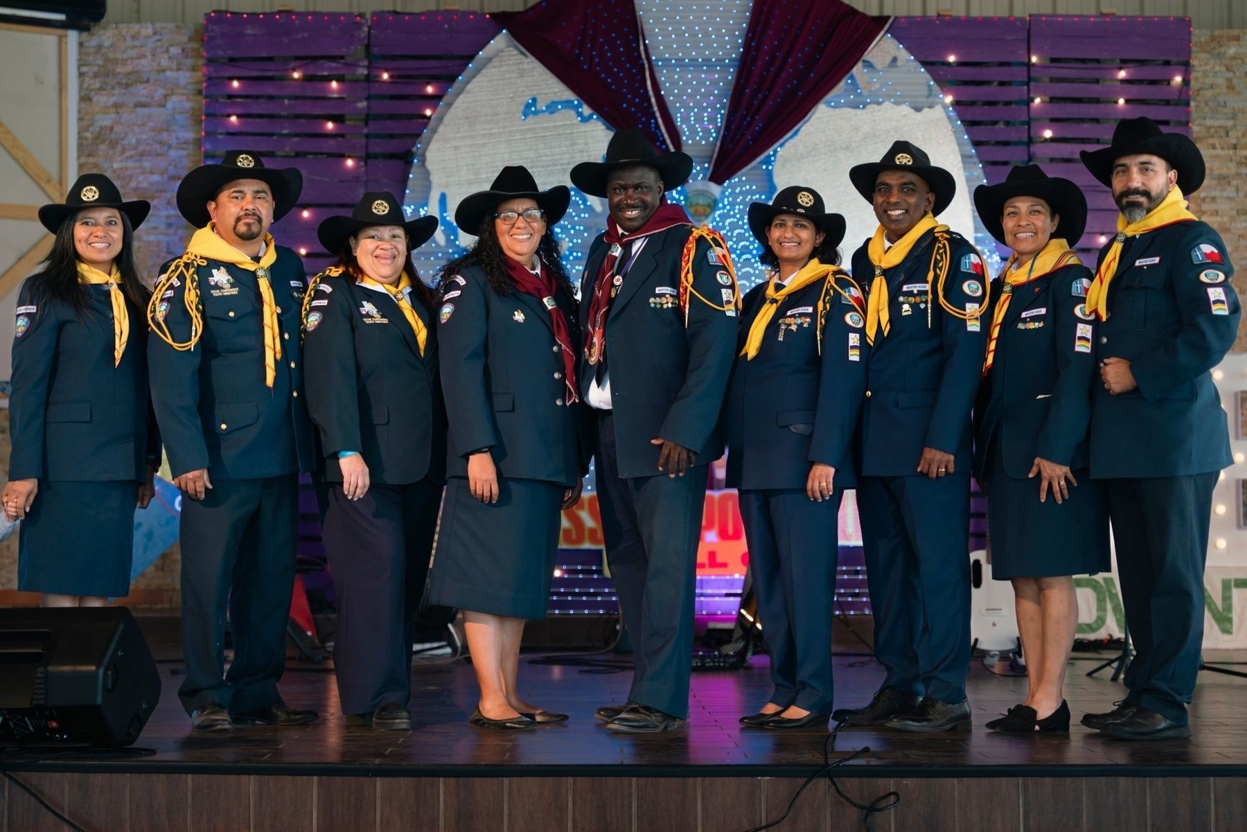 The DET Adventurer council in uniform on stage together