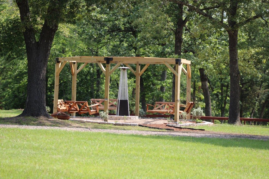 The gazebo and its swings at Lone Star Camp during the day